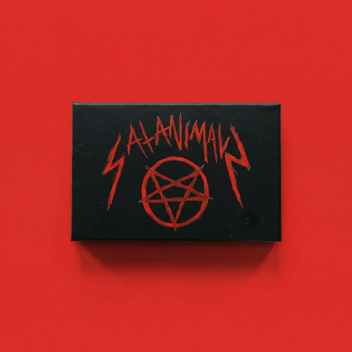 Black SATANIMALS game box with red pentagram on red background