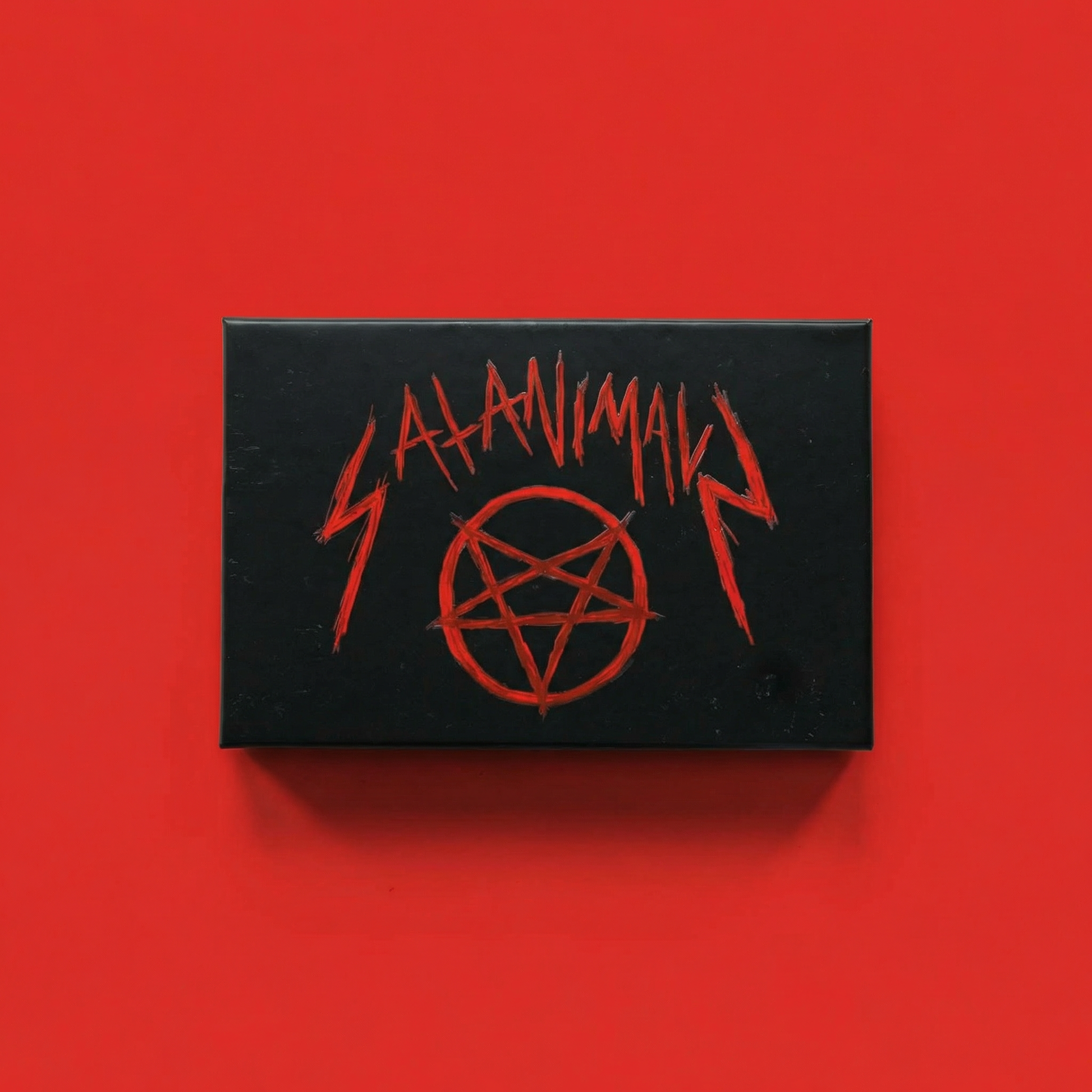 Black SATANIMALS game box with red pentagram on red background